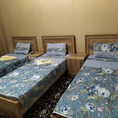 Uvaysiy Family Guest House Marghilon Bagian luar foto