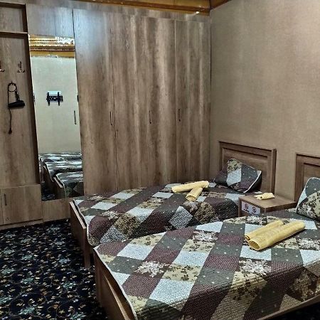 Uvaysiy Family Guest House Marghilon Bagian luar foto