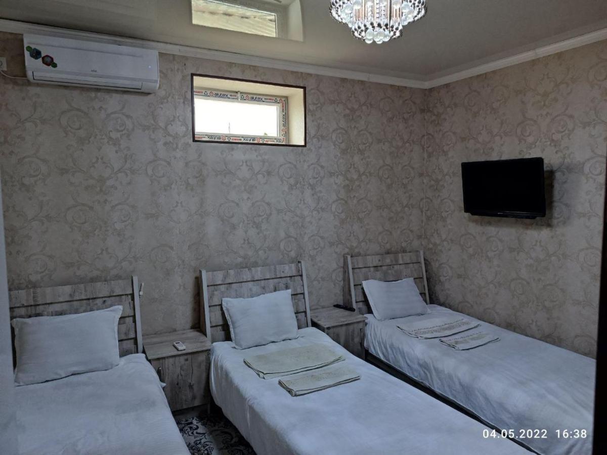 Uvaysiy Family Guest House Marghilon Bagian luar foto