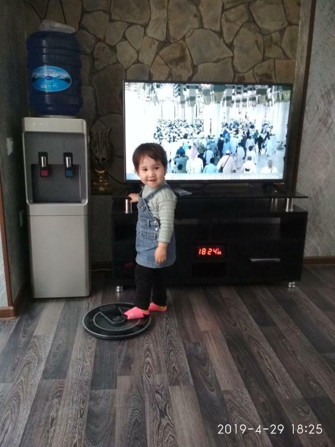 Uvaysiy Family Guest House Marghilon Bagian luar foto