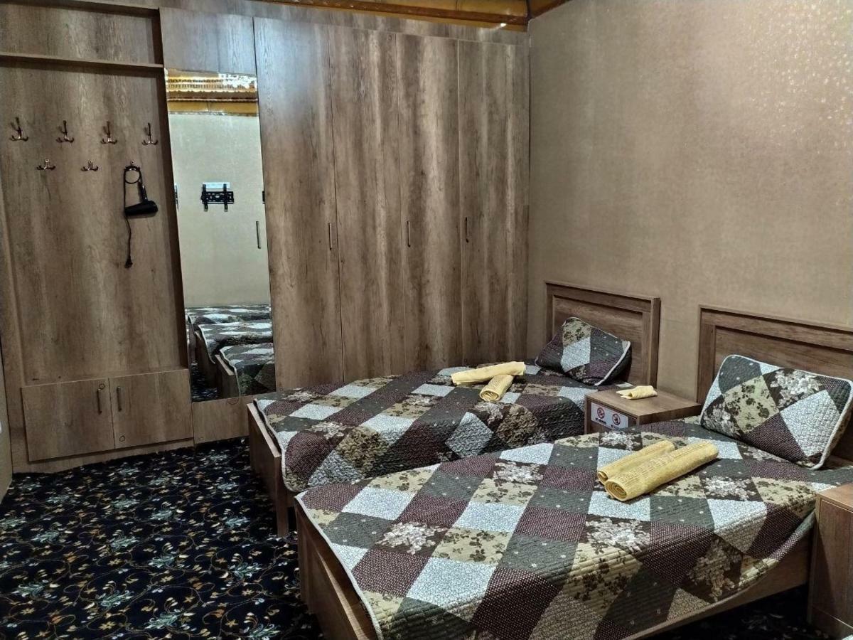 Uvaysiy Family Guest House Marghilon Bagian luar foto