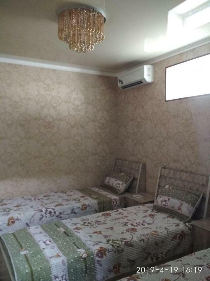 Uvaysiy Family Guest House Marghilon Bagian luar foto