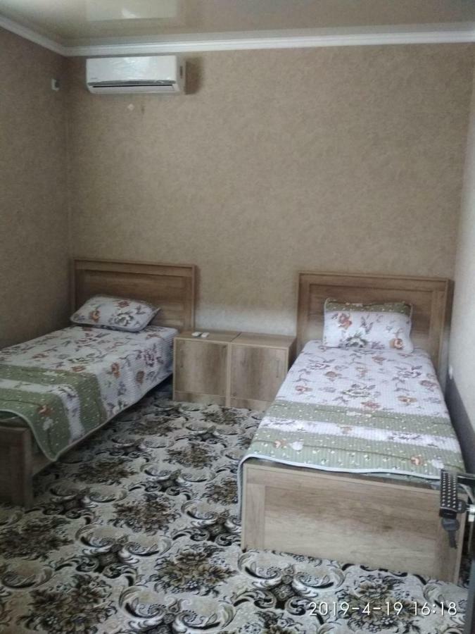 Uvaysiy Family Guest House Marghilon Bagian luar foto